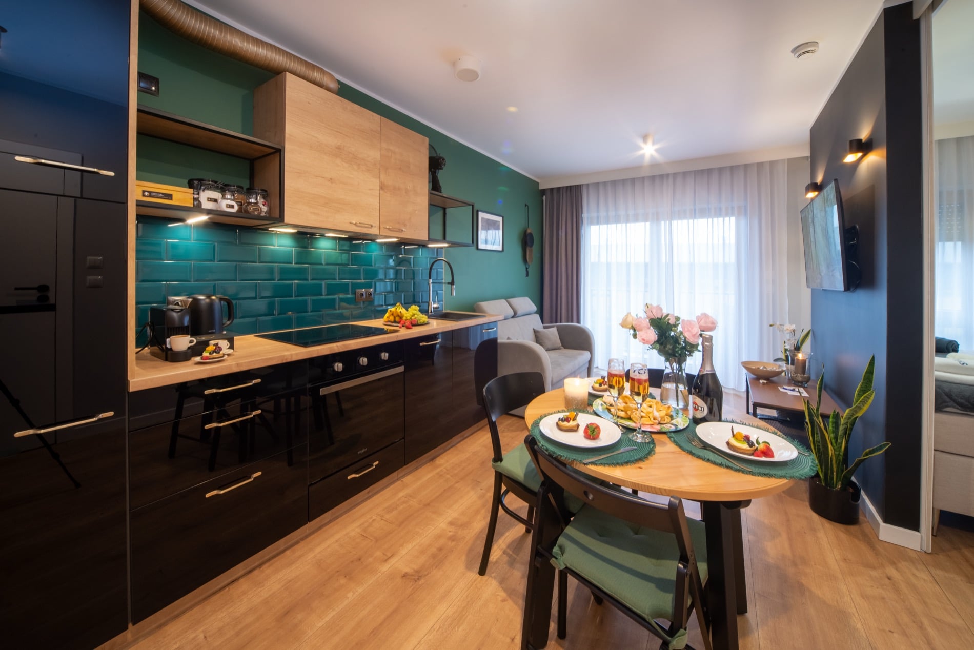 Nad Motławą riverside apartment with teal kitchen and warm wood in Gdańsk