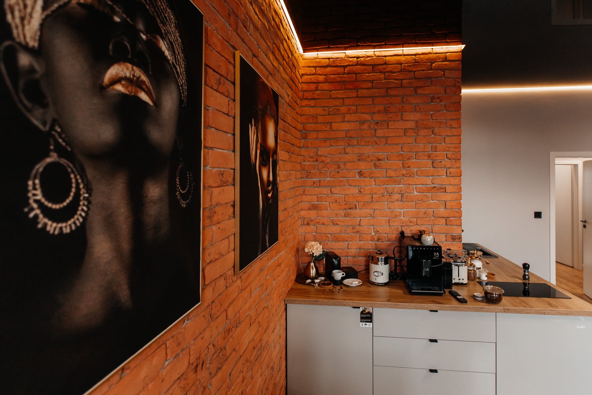Ogarna Loft with exposed brick and gold accents in Gdańsk Old Town